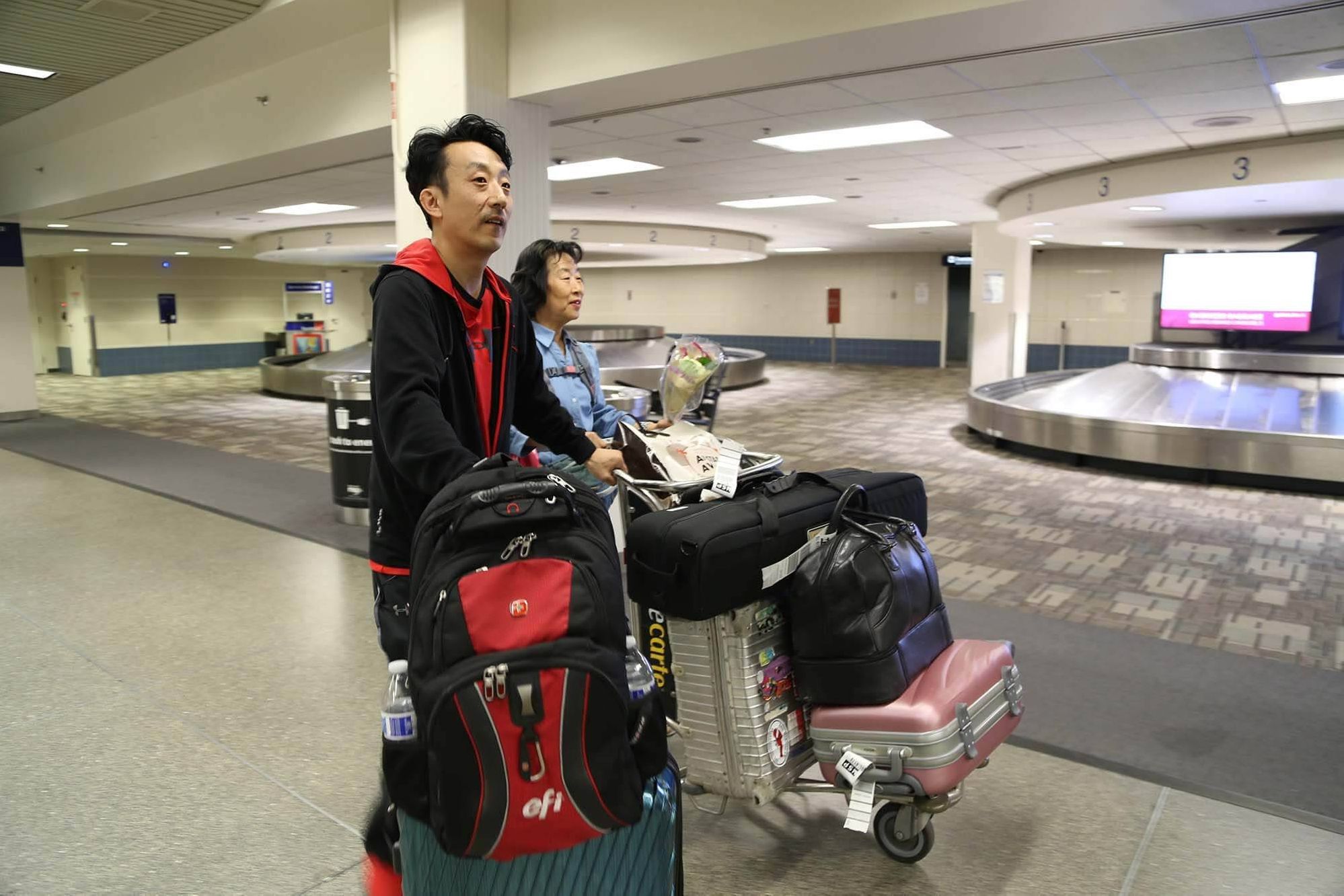 Layne Fostervold, 47, and his Korean mother, Sook-nyeon Kim, 71, arrive at Minneapolis-St. Paul International Airport on Sunday.