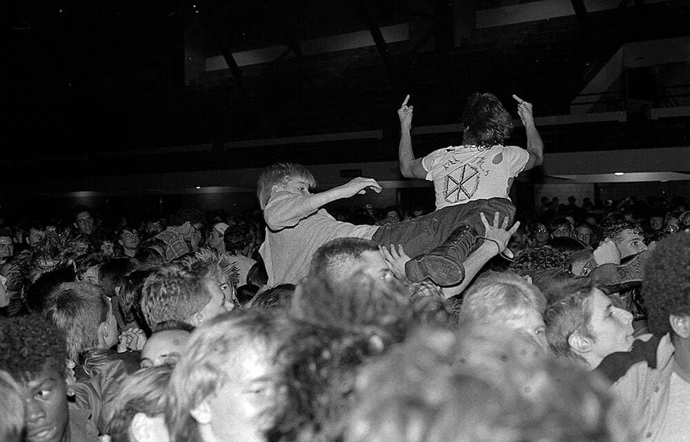 Minnesota kids stage diving at a Dead Kennedy's show, expressing joy and love.