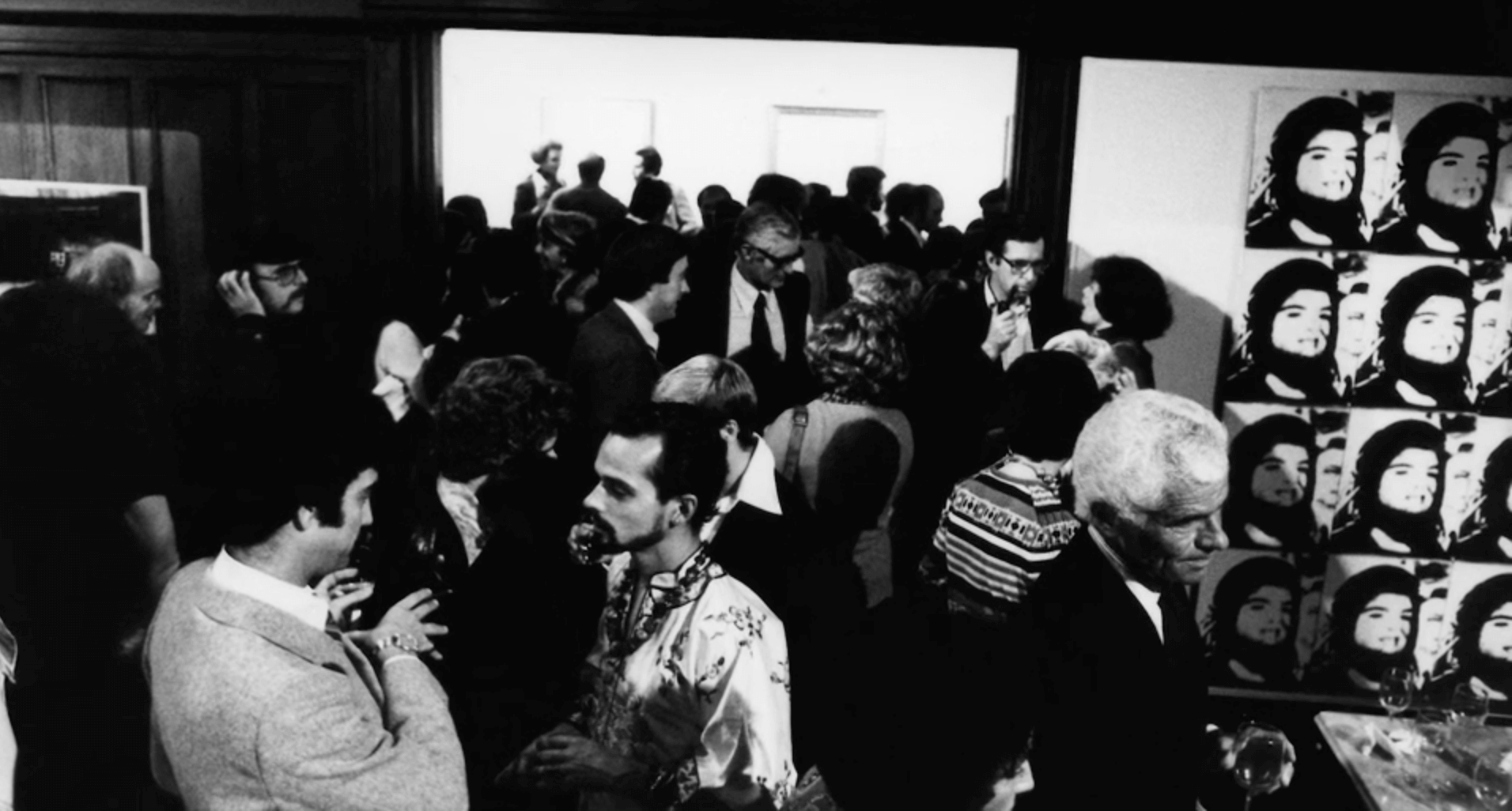 Black and white photo of a party for Andy Waqrhol at the Mount Curve mansion of Gordon Locksley and George Shea