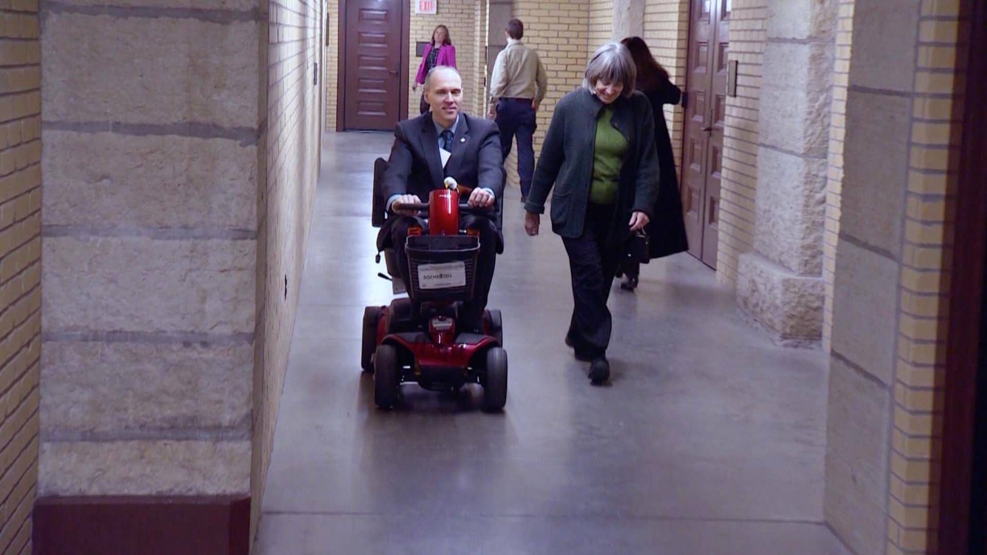 Rep. Rod Hamiliton (R-Mountain Lake) uses a motorized wheelchair in the tunnel underneath the Capitol that runs to the State Office Building.