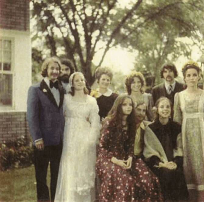 Here is a family photo of us at my sister's wedding. Michael, my brother that served in Vietnam, is standing in the last row on the right. Three of my brothers were drafted, and so my mother wrote a letter requesting that one son please be left at home. The youngest brother is missing in the picture because he was serving at the time, and the brother that is seated in the middle finished his three years of service. All of us children were a year apart in age.