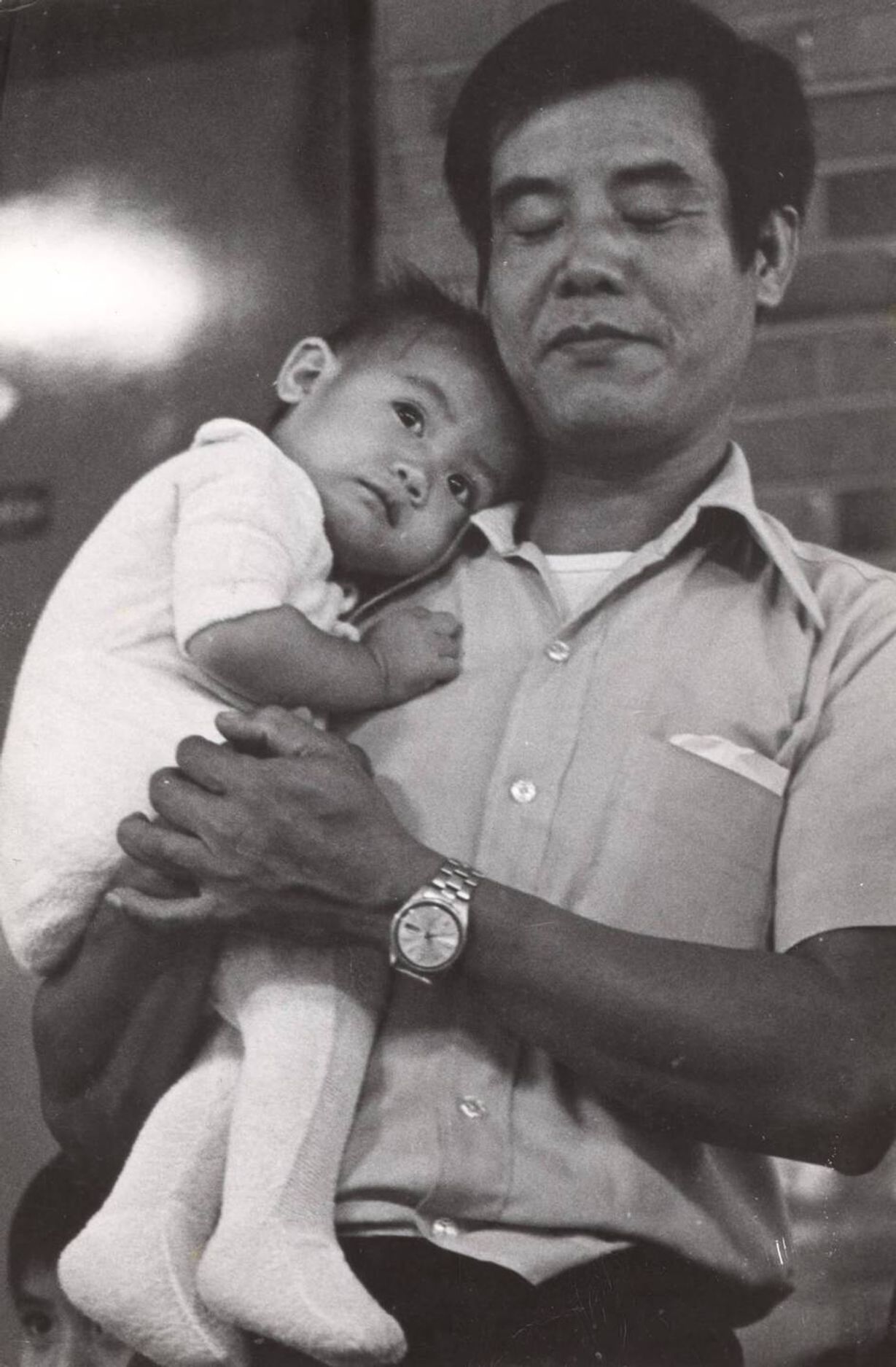 The author at 11 months and her father shortly after touching down in Minnesota for the first time. Photo courtesy of the author.