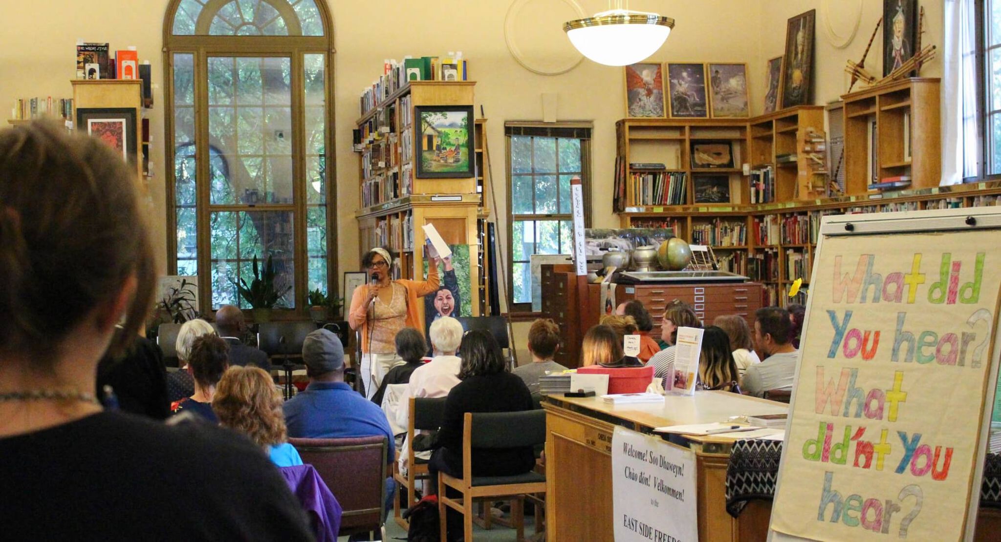 Woman speaking to a group in a library