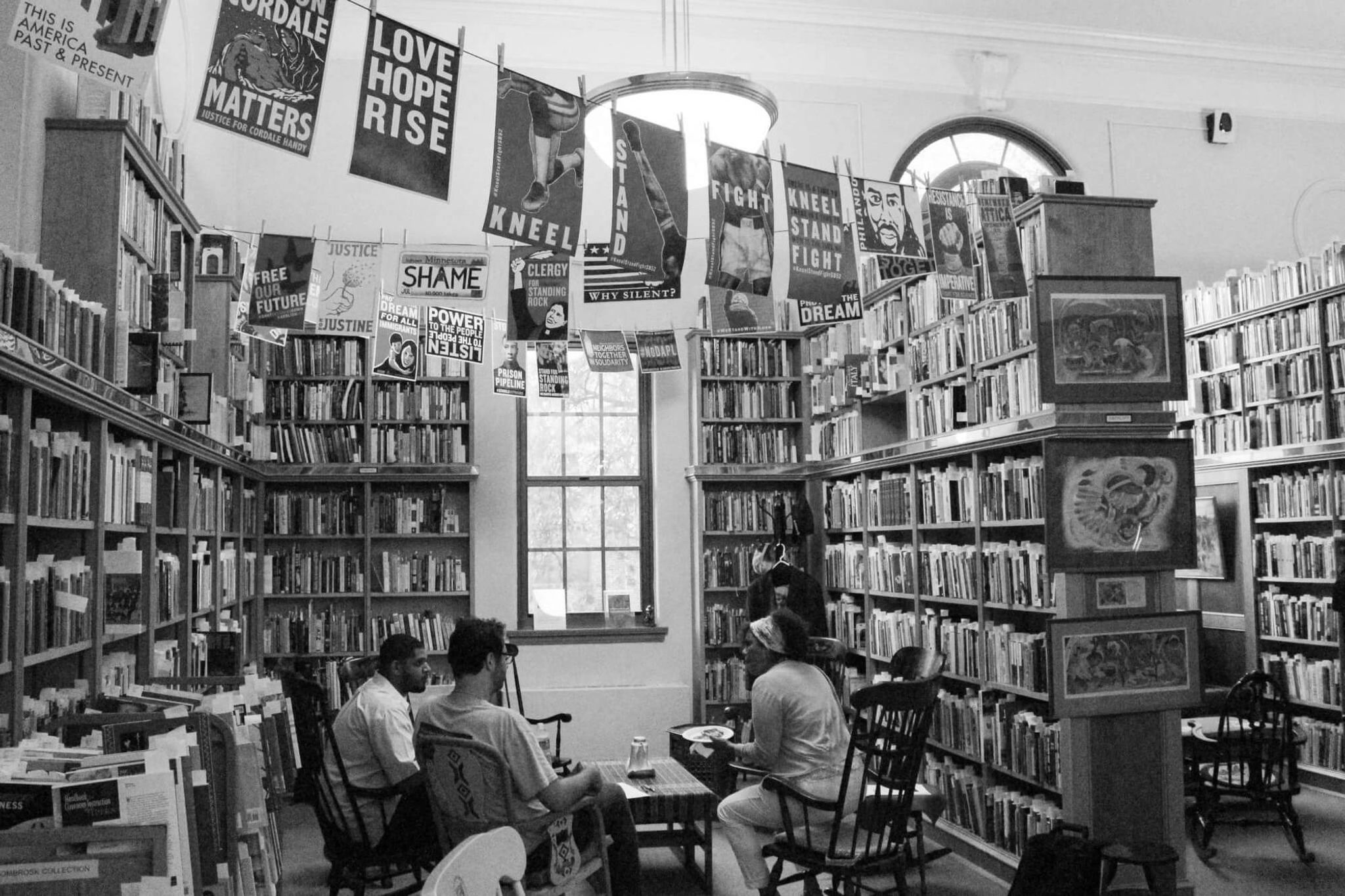 Group of people talking in a library