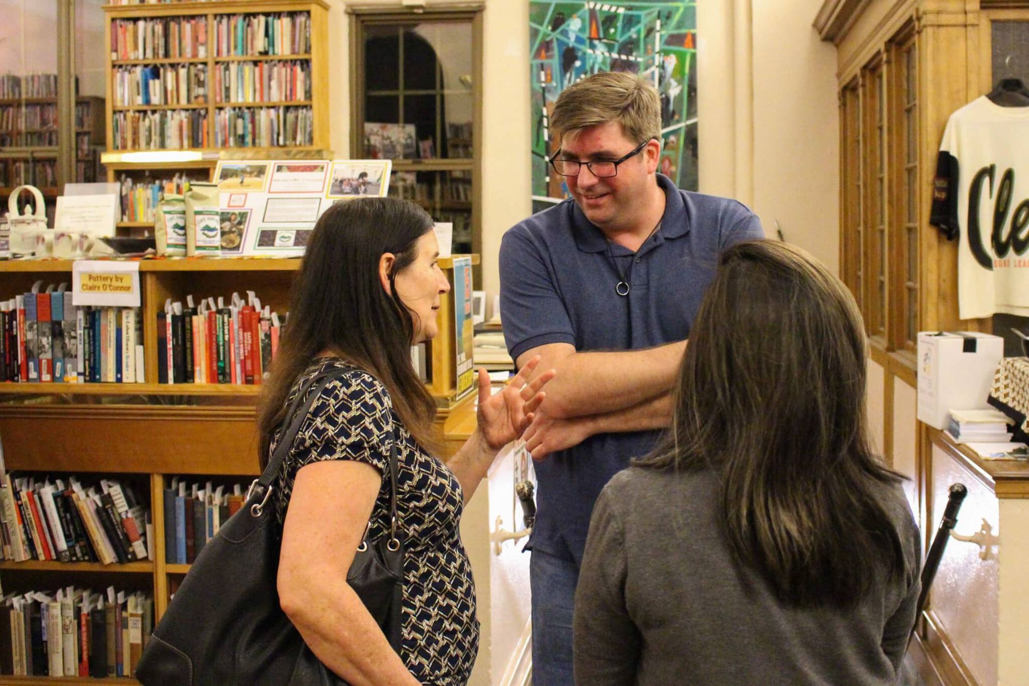 Group of people talking in a library