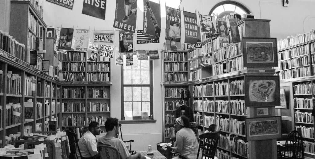 Group of people talking in a library