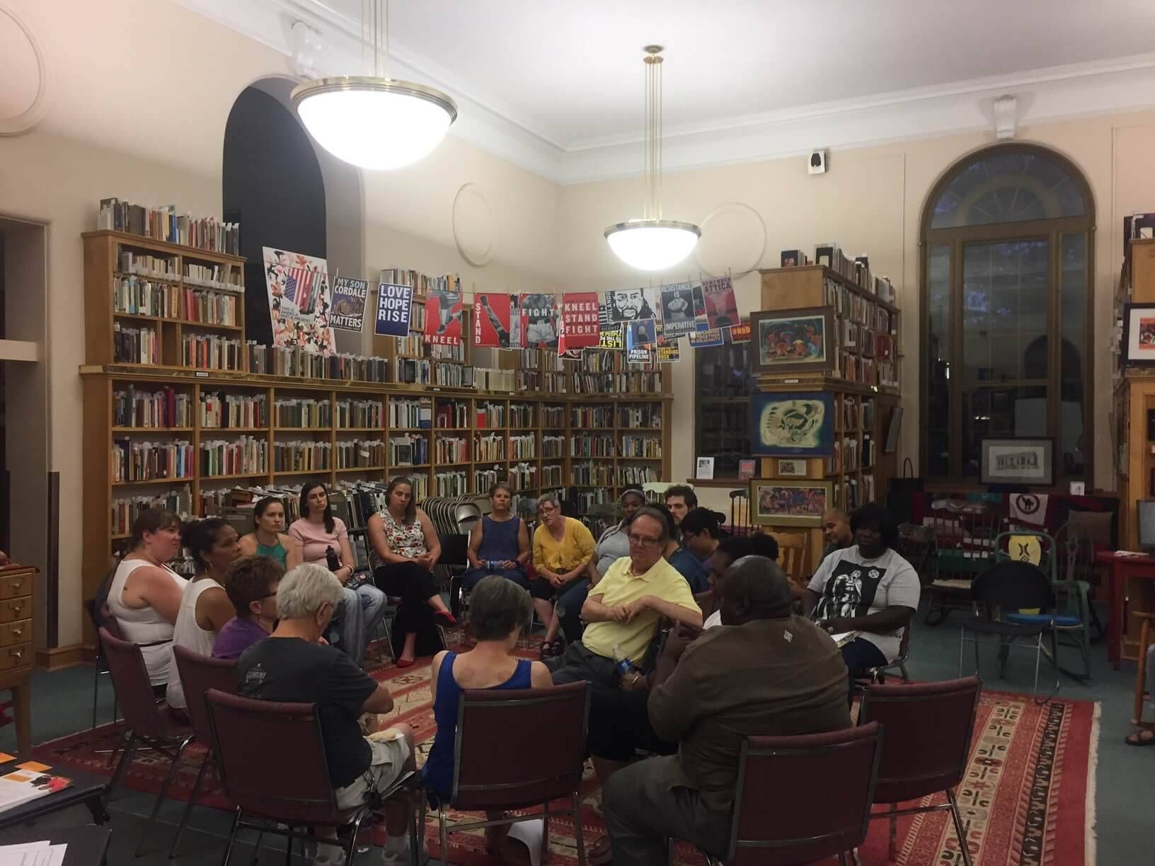 Group of people talking in a library