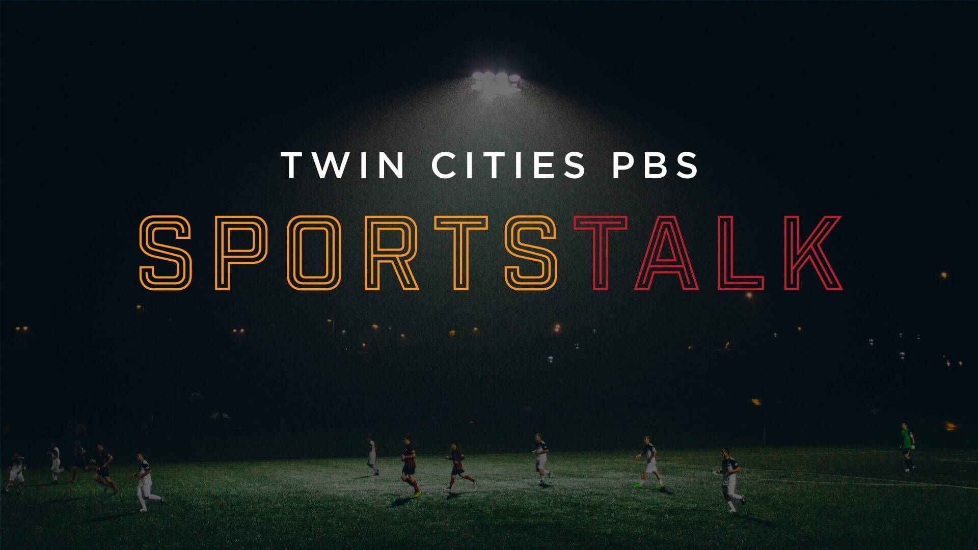 A title written in white, orange and red text reads "Twin Cities PBS Sportstalk" and is laid over a faded image of people playing soccer at night.  A bright light illuminates the field. 