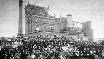a large group of people in front of a building