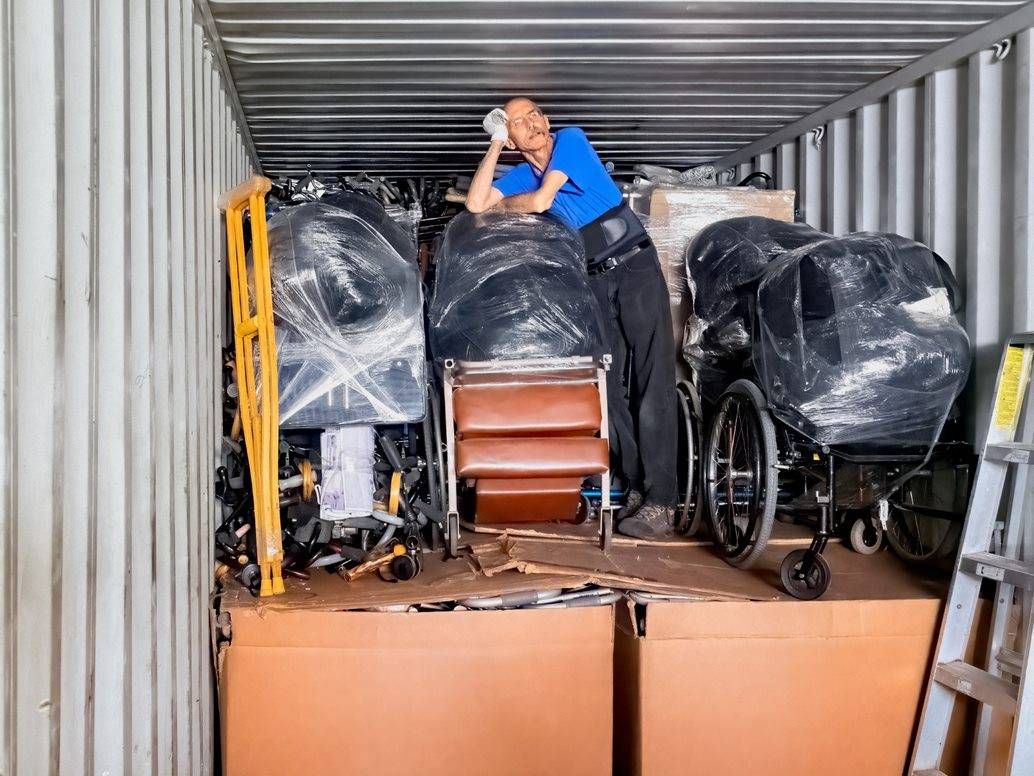 Mano a Mano Warehouse Manager Ray Wiedmeyer takes a break after loading a truck filled with medical supplies destined for Bolivia.