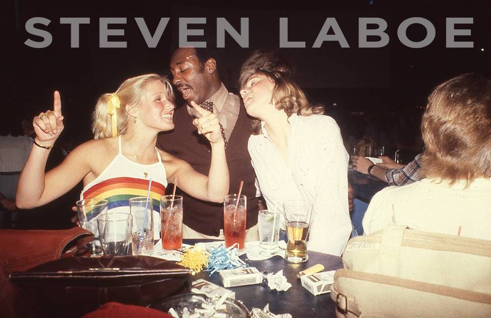 Roberta (in the rainbow tank top) with friends at Uncle Sam's, 1977.