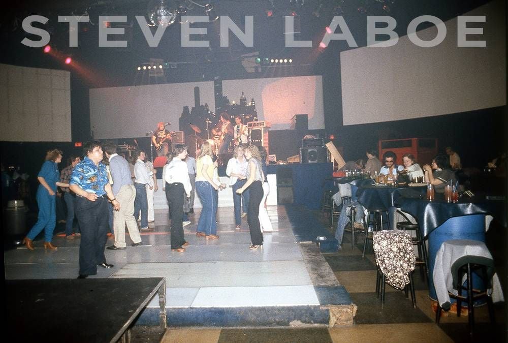 A cameo appearance by Charlie Burton and the Cut Outs at Sam's, 1981. (The raised, lit-up, neon dance floor has seen better days).