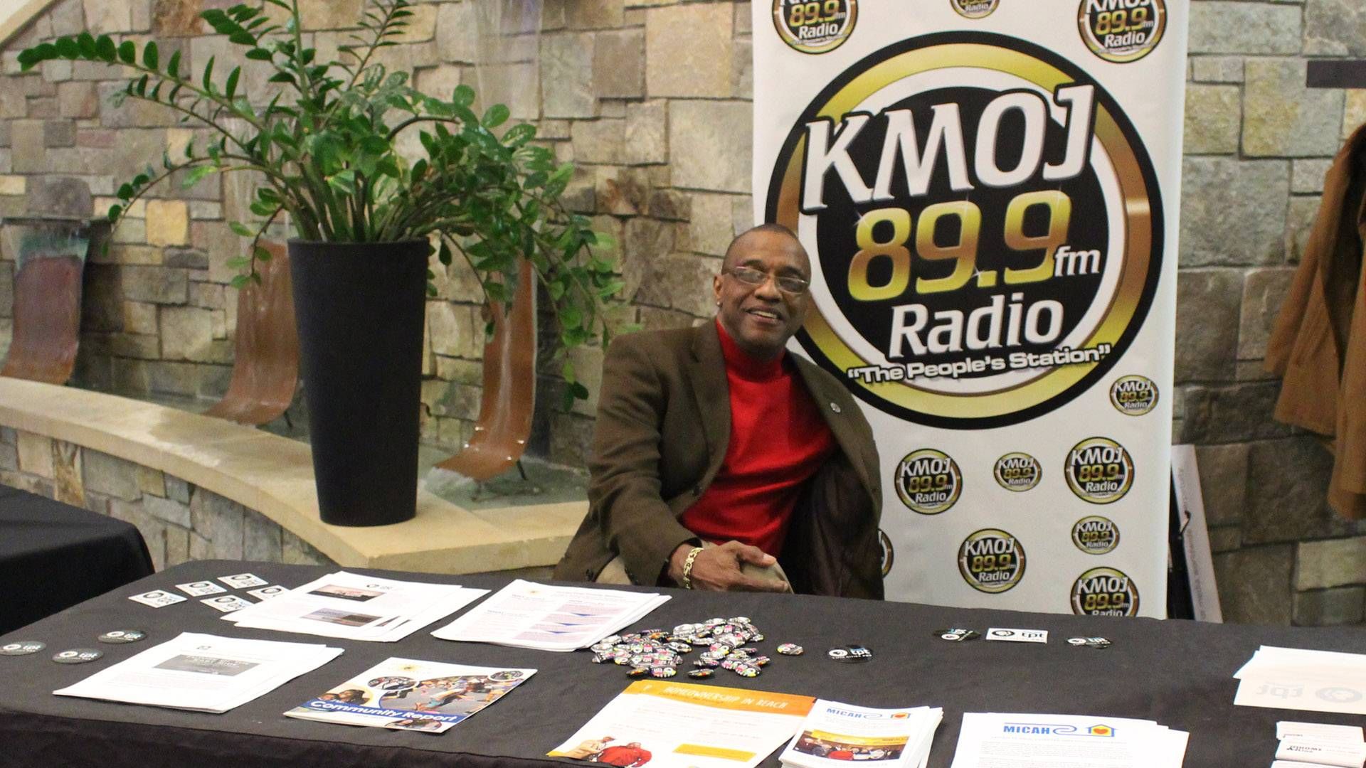 Man sitting at a table at an event