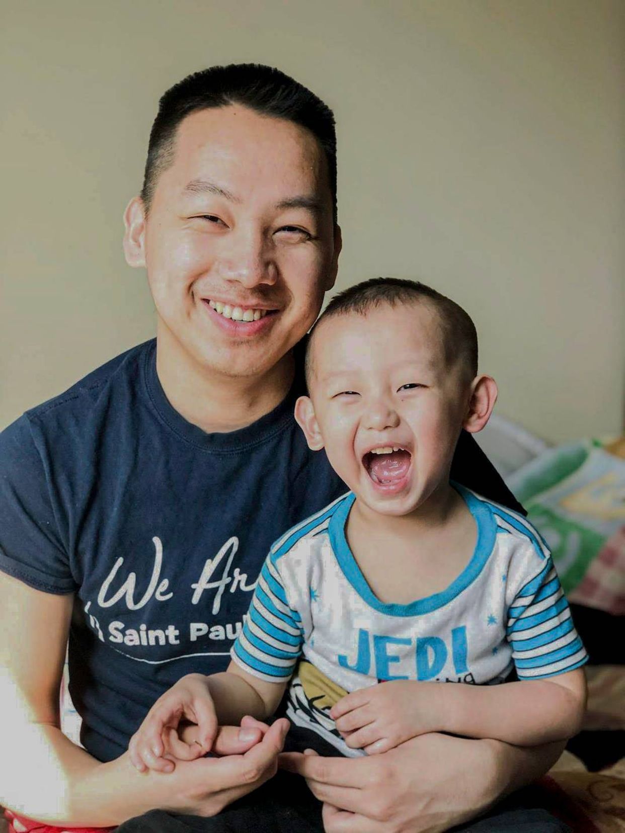 Photo of father and son smiling