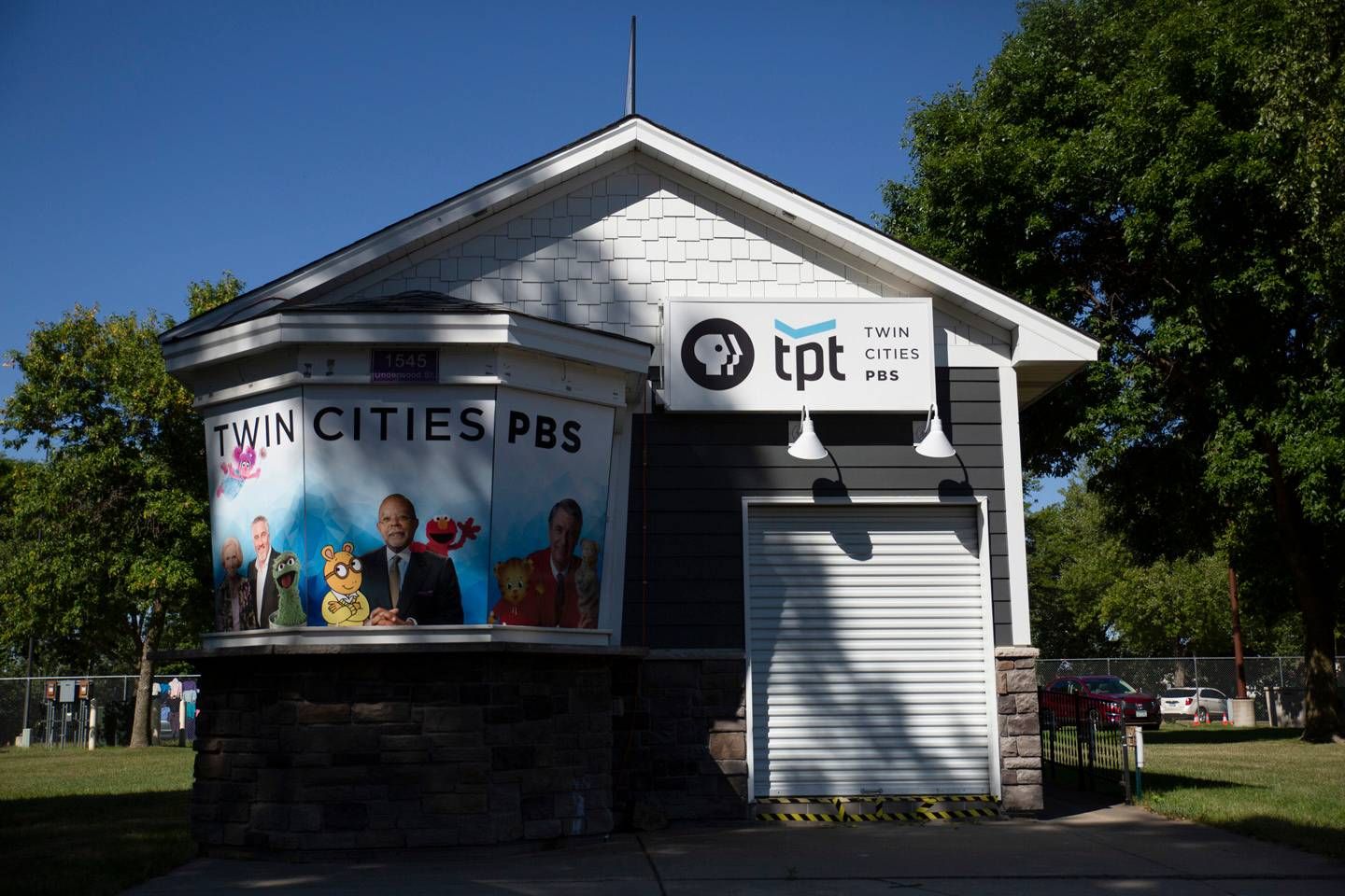 White TPT booth at the Minnesota State Fair with images of Mr. Rogers, Elmo, and other PBS characters.