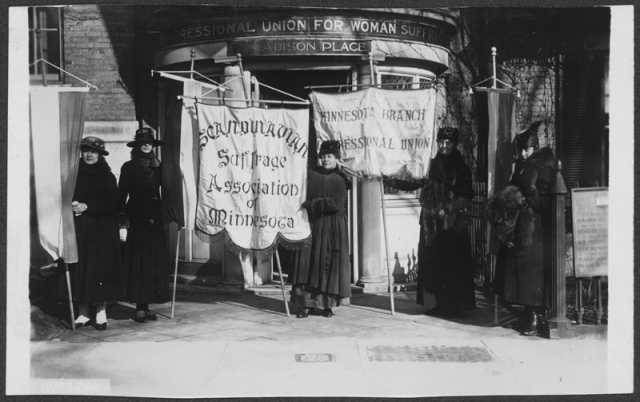 Minnesota Suffragists stand outside the National Woman’s Party Headquarters.