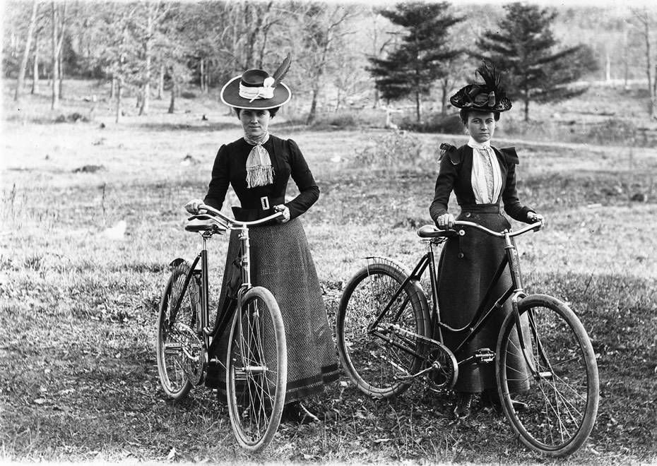 Two women stop during a bicycle ride around the Schenectady area, ca. 1900. Women's participation in the bicycle craze during the 1890s led to the decline of corsets, inspired "common-sense" dress, and allowed greater mobility for women. Source: alloveralbany.com.