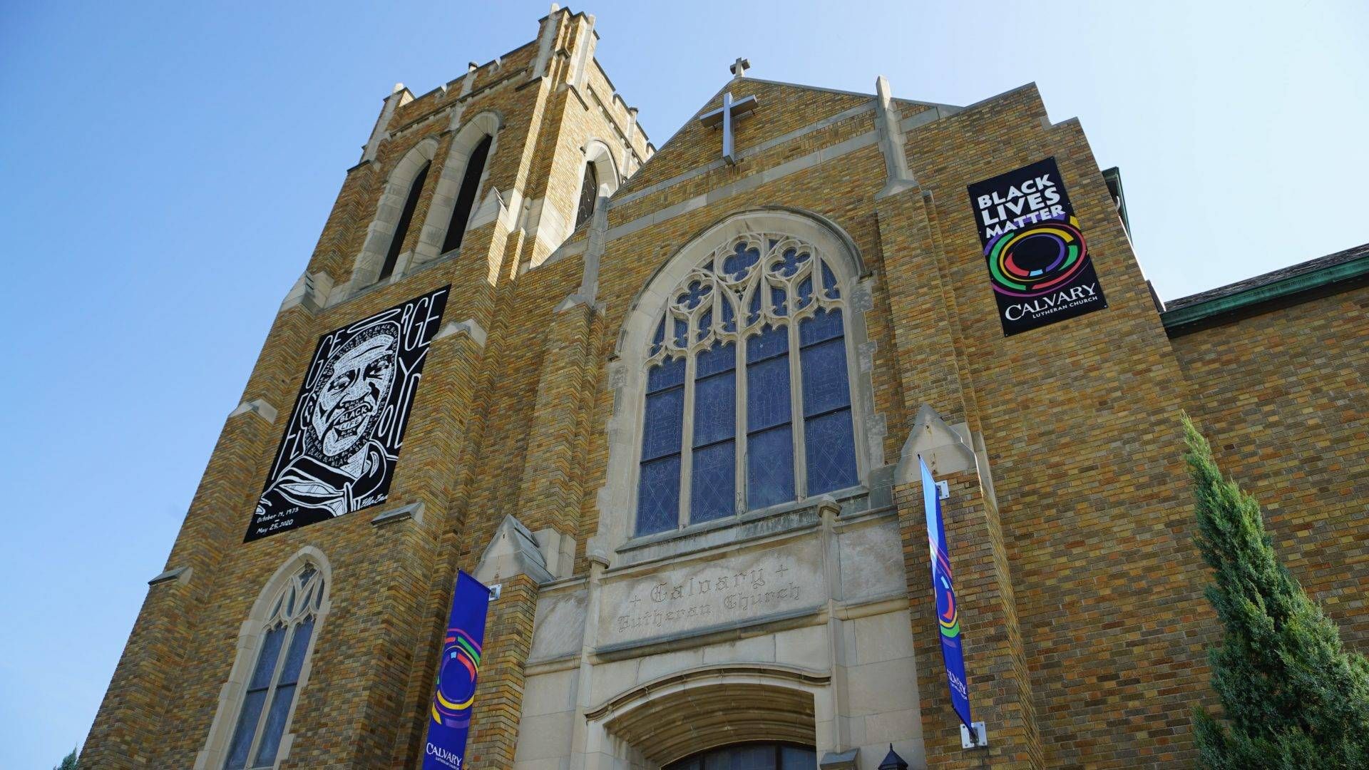A mural for Goerge Floyd and a Black Lives Matter sign above the Calvary Lutheran Church where Reverend Hans Lee preaches, on Sept. 20, 2020. Members worried the signs would provoke white supremacists to target the church when protests for Floyd began.