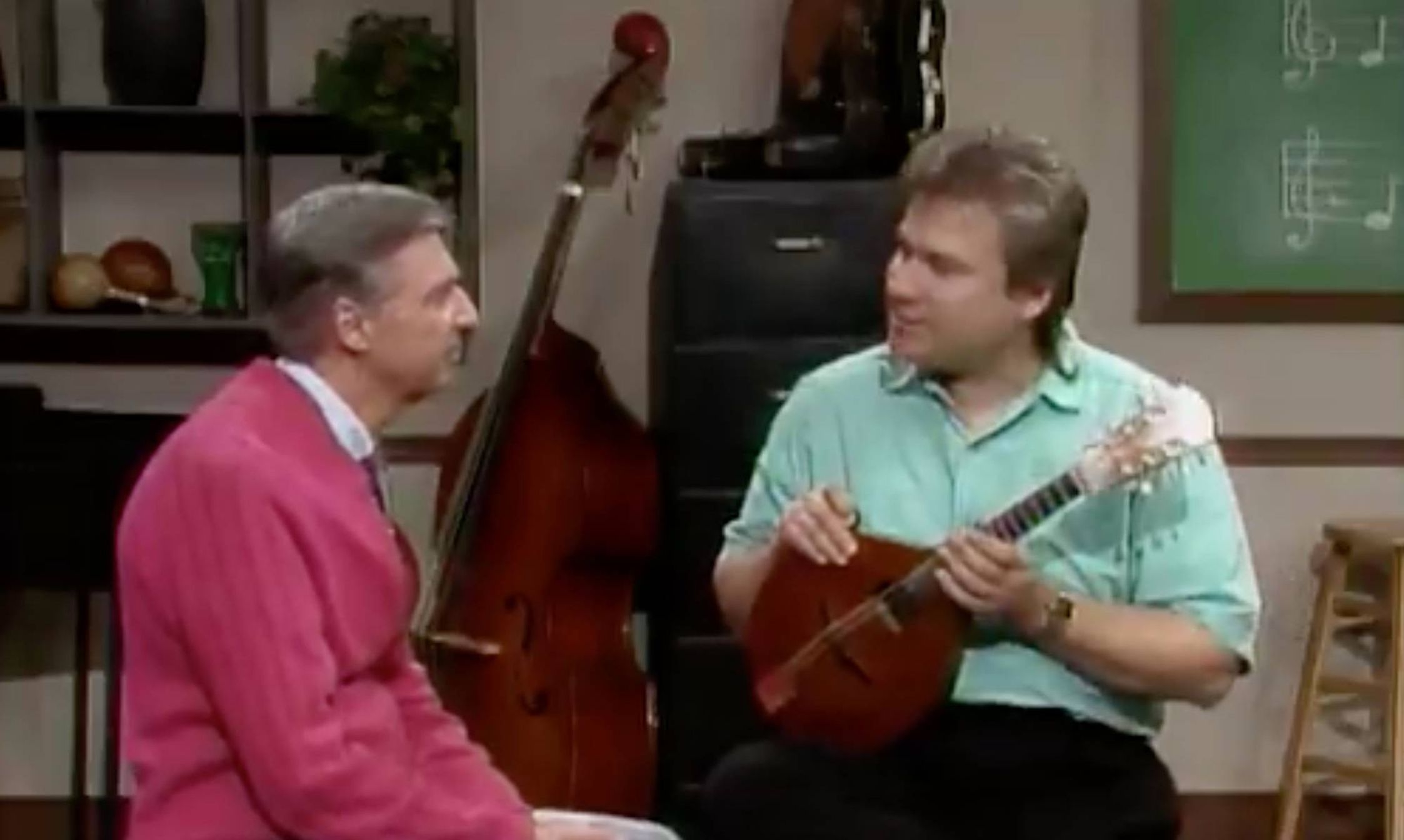 Freeze frame of Mister Rogers and Peter Ostroushko from 1993.
