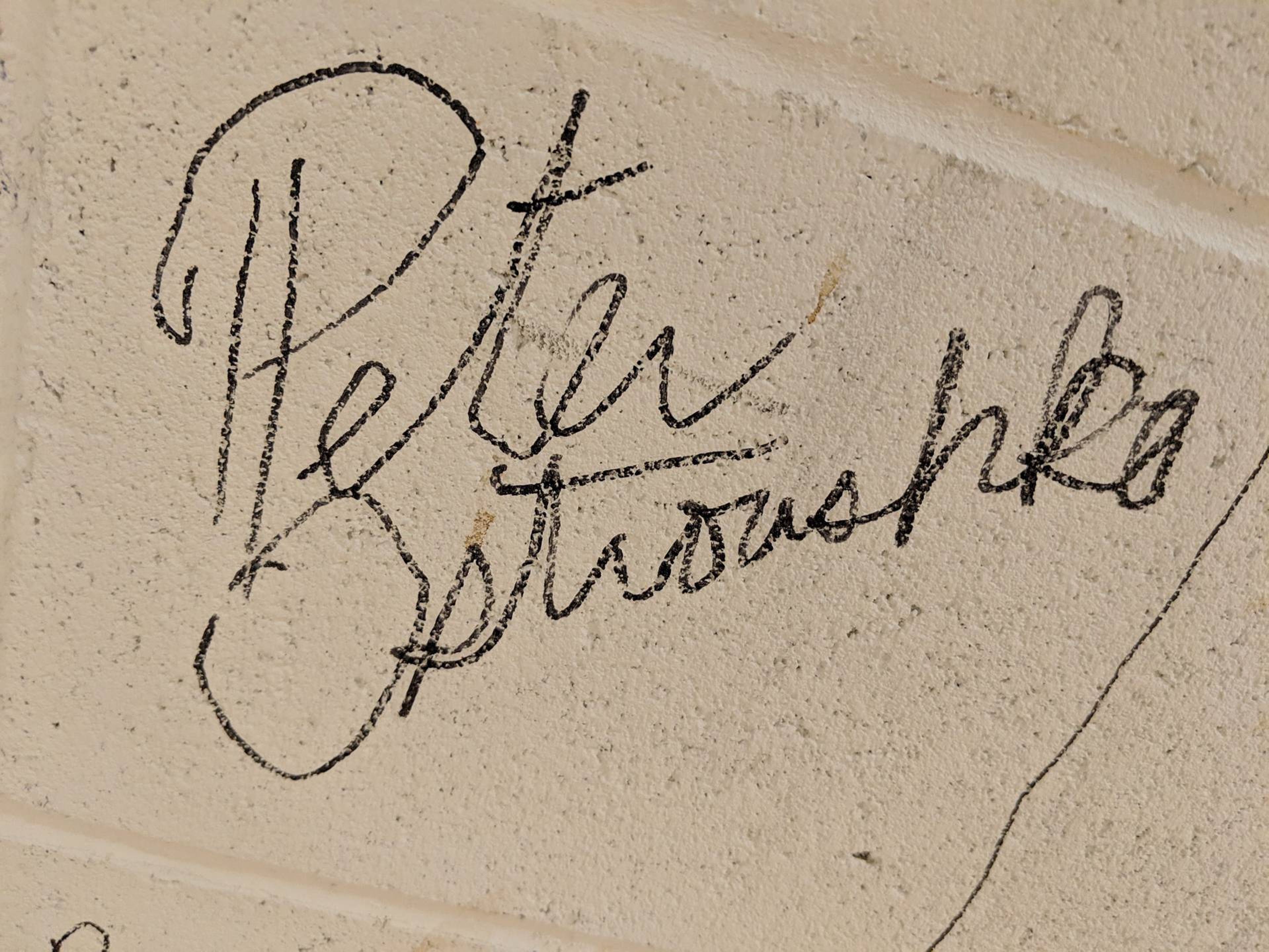 Ostroushko's brick on the wall leading to the studios at Twin Cities PBS.