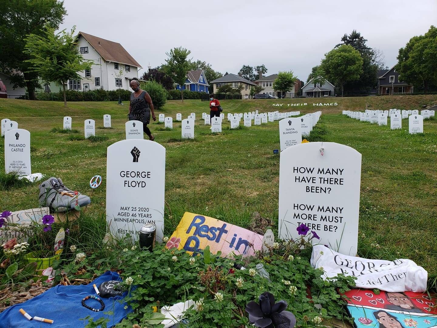 A memorial near 38th and Chicago with names of Black people killed over time.