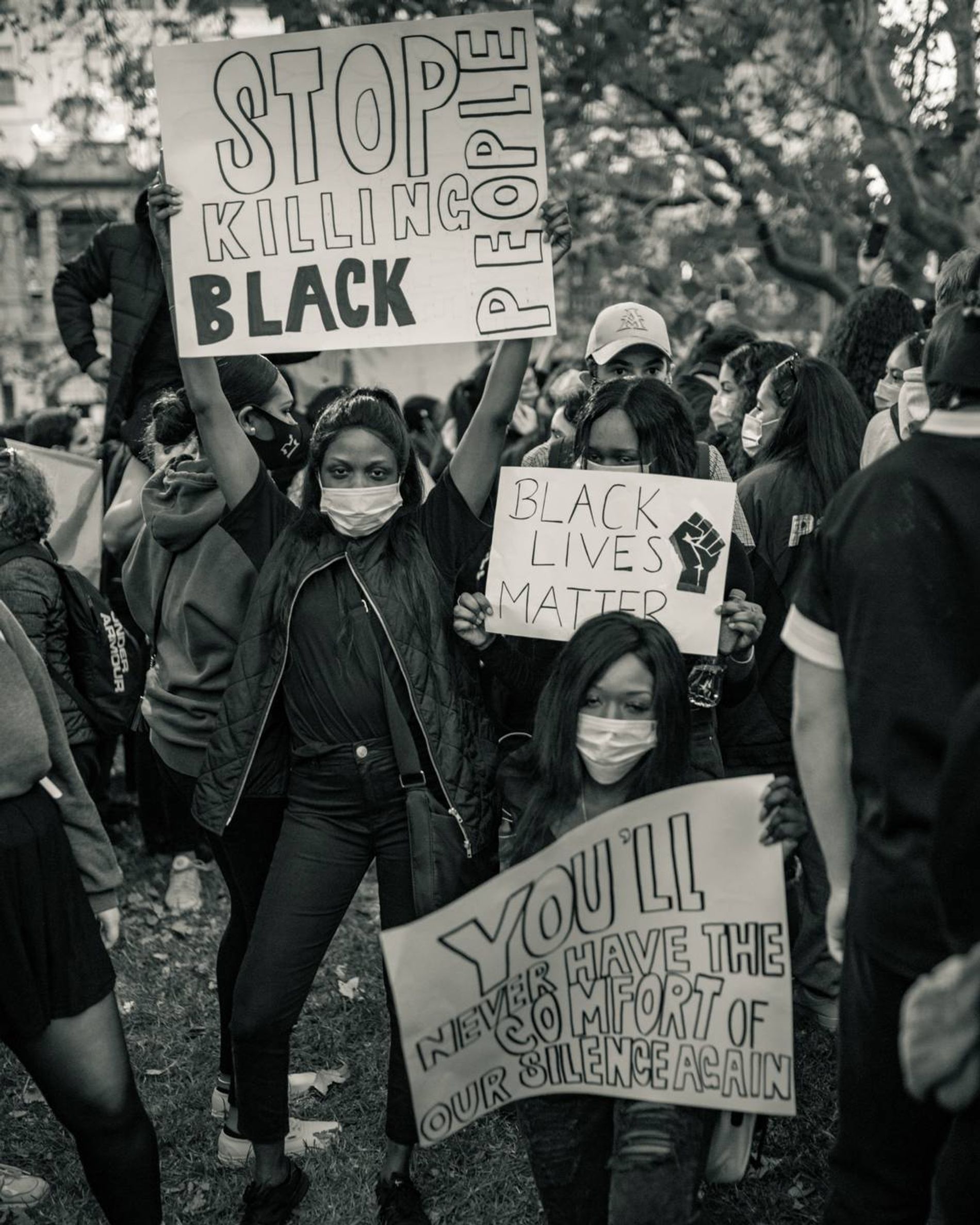 a group of people holding signs