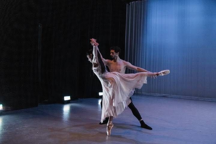 a person and person dancing on a stage