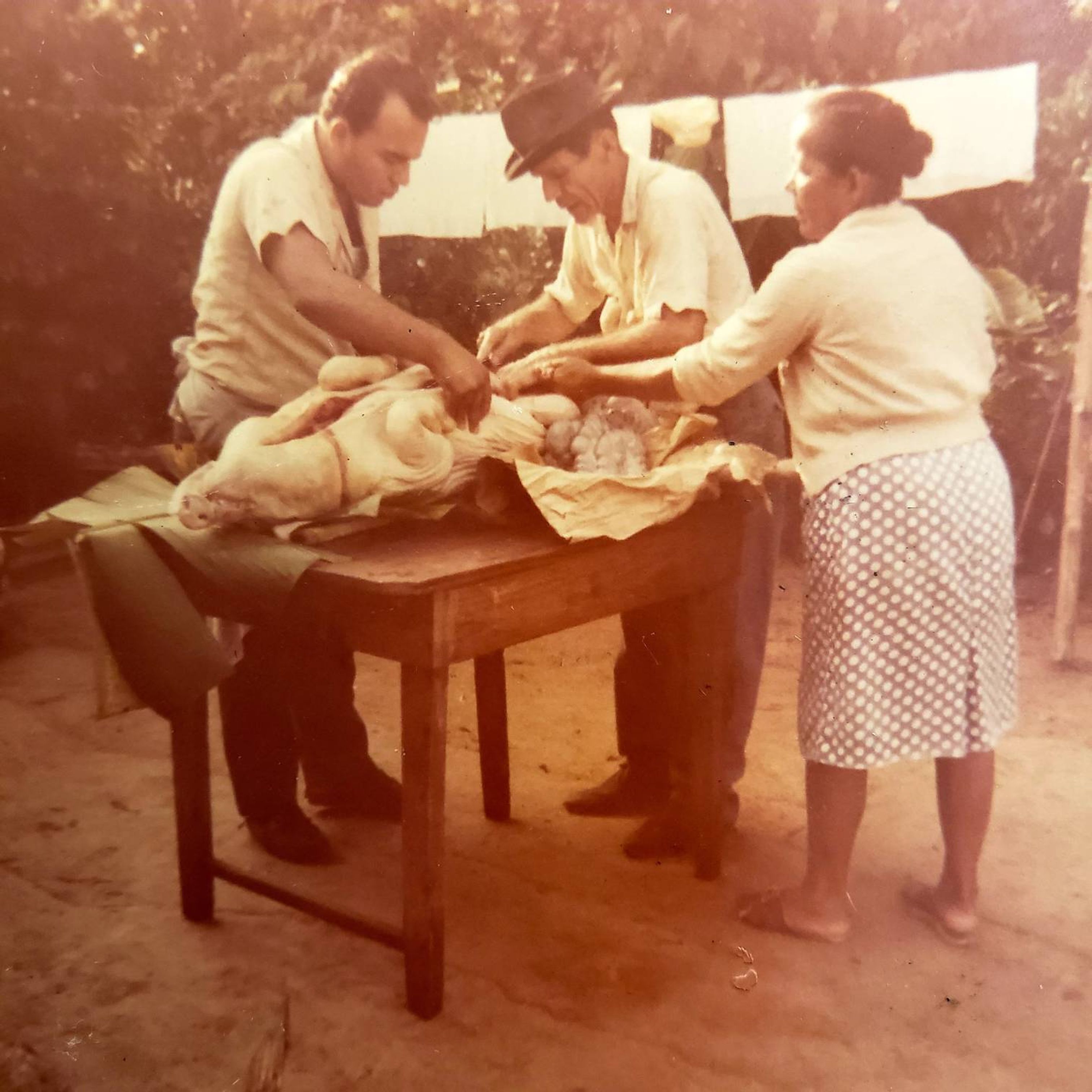 Nettie Colón's grandma and family butcher a pig