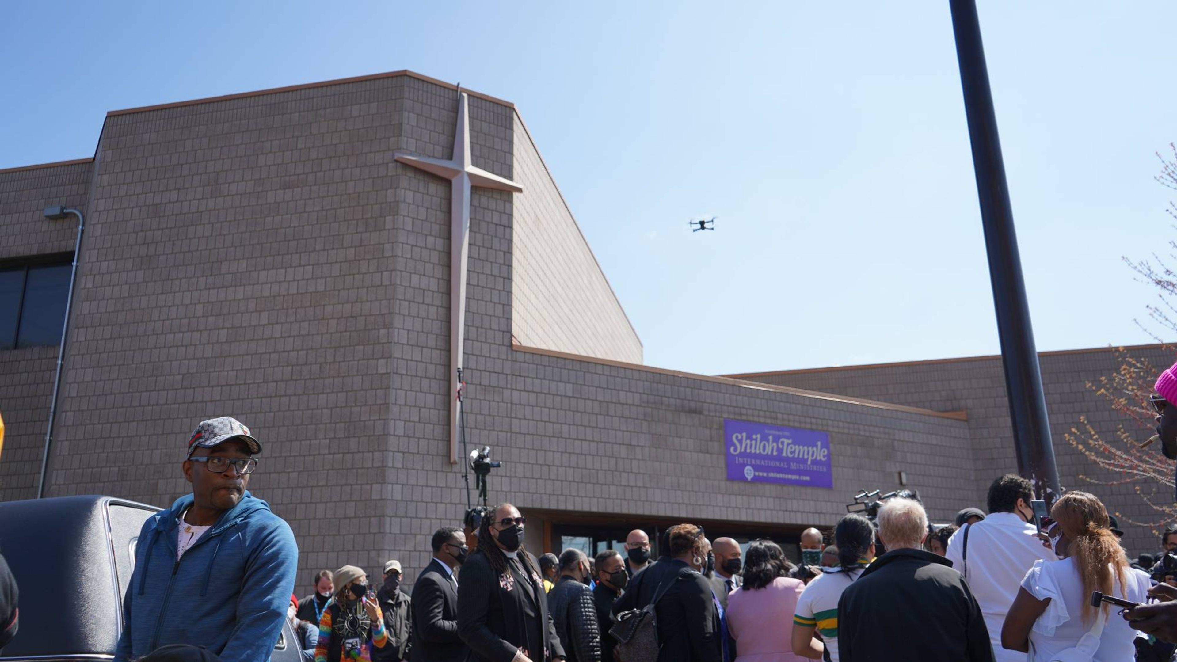 Drones, cameras, audio recorders and more surround the entrance of Shiloh Temple International Ministries.