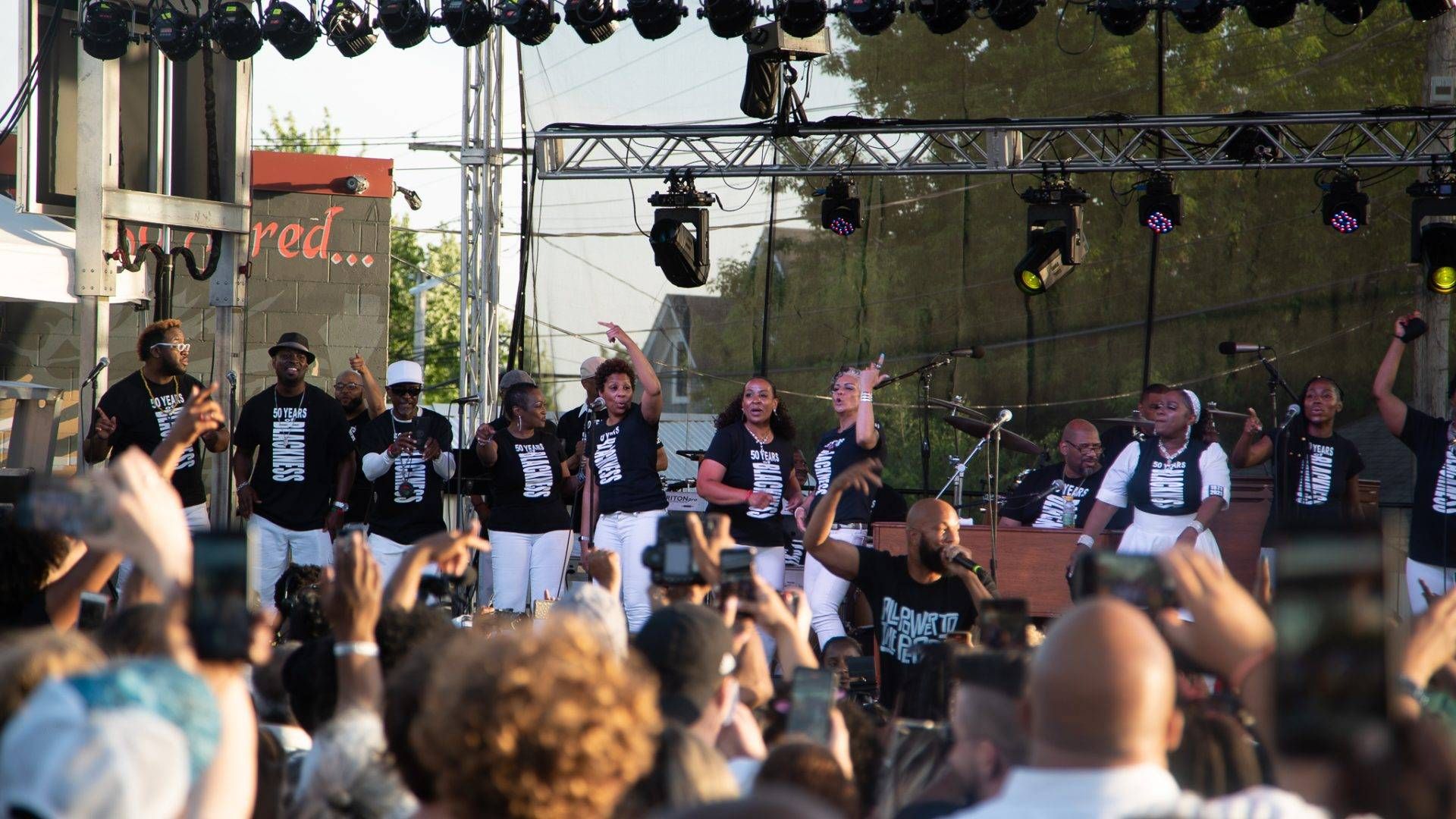 Rapper Common and the musical group Sounds Of Blackness perform at George Floyd Square. Common thanked U.S. Representative Ilhan Omar, and encouraged people watching the performance