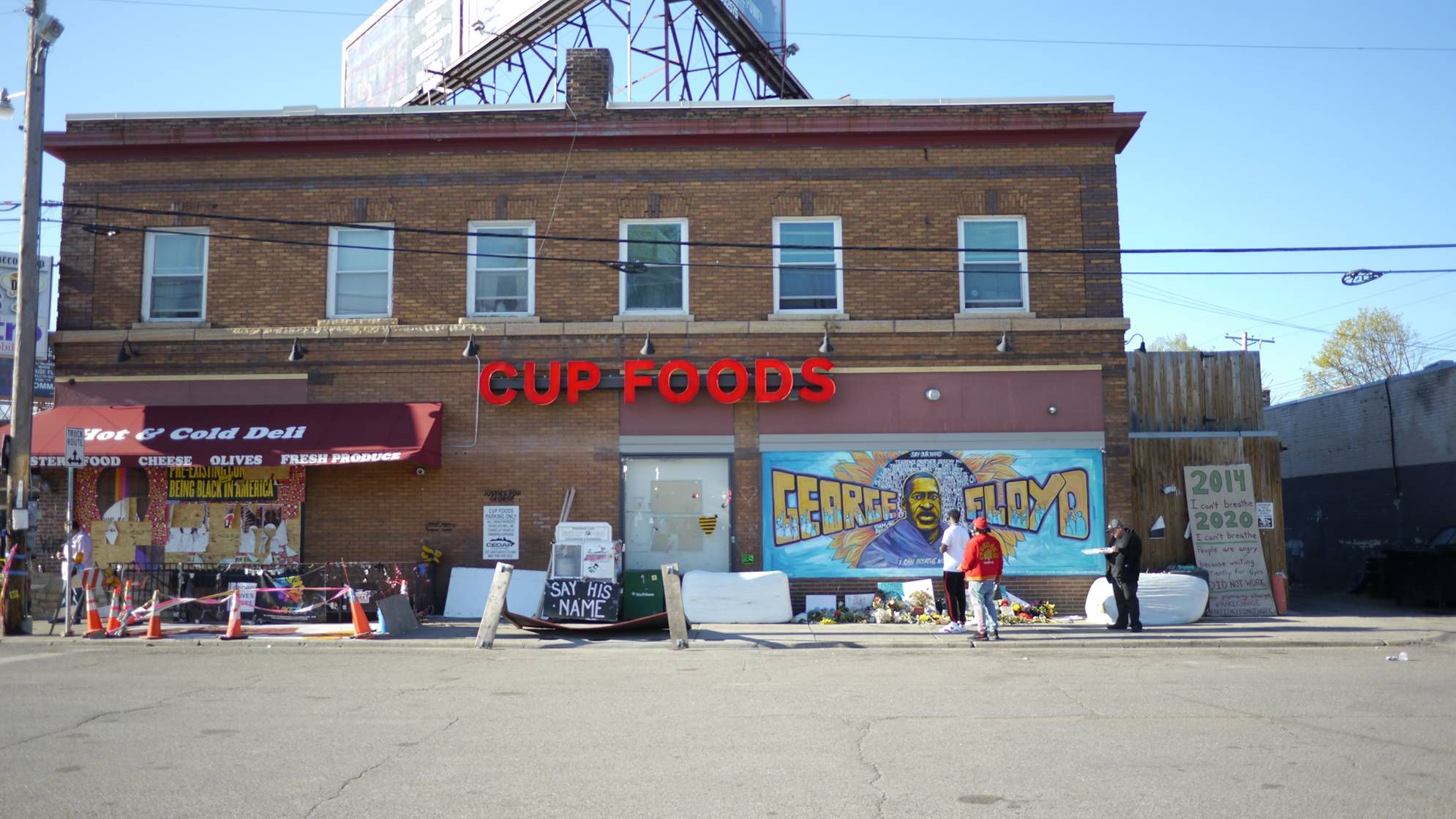 The exterior of Cup Foods displaying the George Floyd mural in situ.
