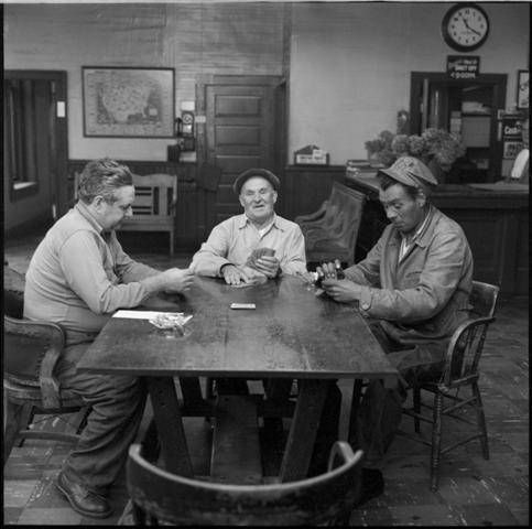 a group of people sitting around a table