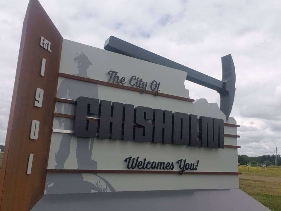 A welcome sign for the city of Chisholm
