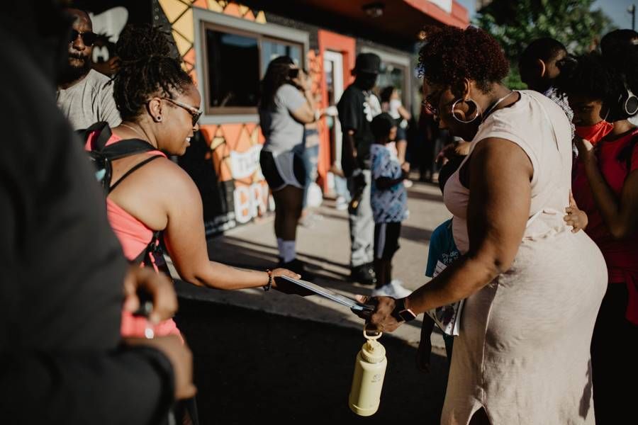 Throughout 2020 and 2021, Crown the Writer has attended a slew of demonstrations and protests to give a copy of her children's book to adults and kids, alike. | Photo courtesy of Crown Shepherd.