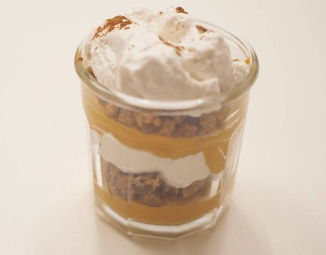 Photo of layers of whipped cream, pumpkin pie mix and a crumble in a jar. Rewire PBS Living pumpkin pie