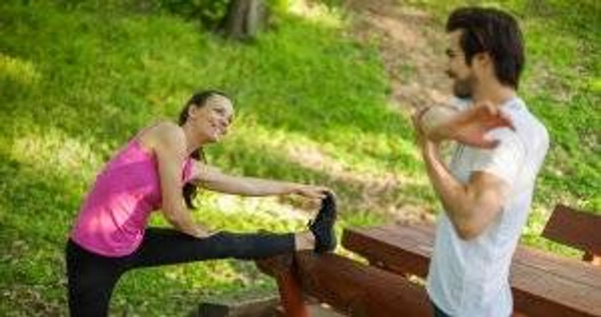 Couple is exercising in park. pbs rewire