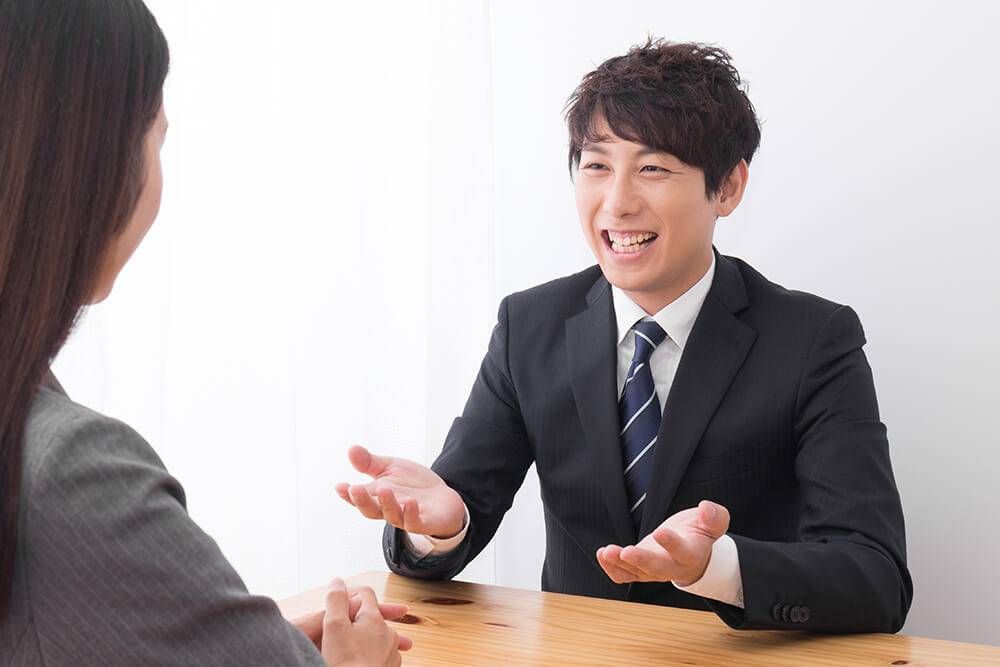 A young male job applicant addresses his interviewer with a bemused expression. Rewire PBS work Interview
