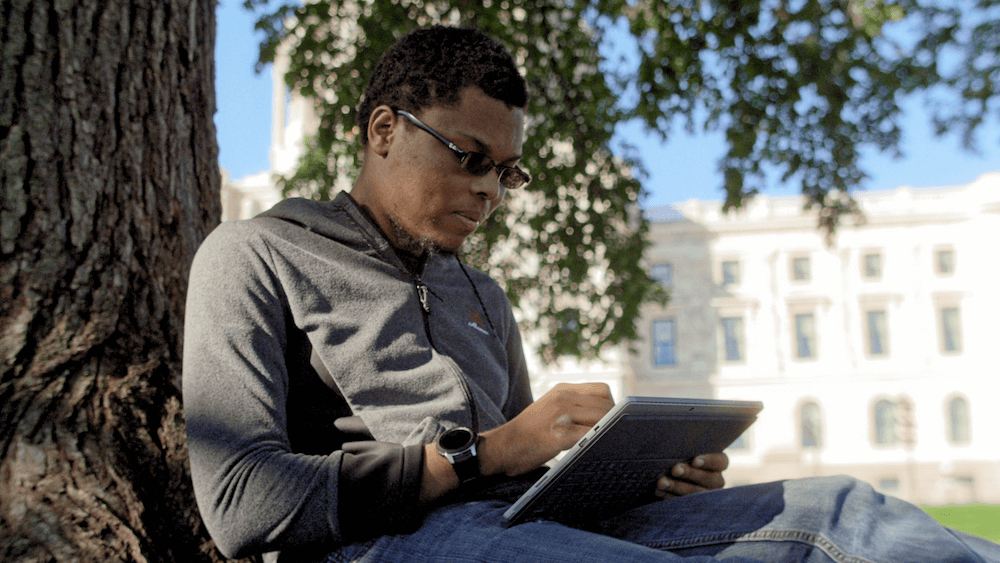 Charles McGregor works on a game on his tablet. Video Games pbs rewire