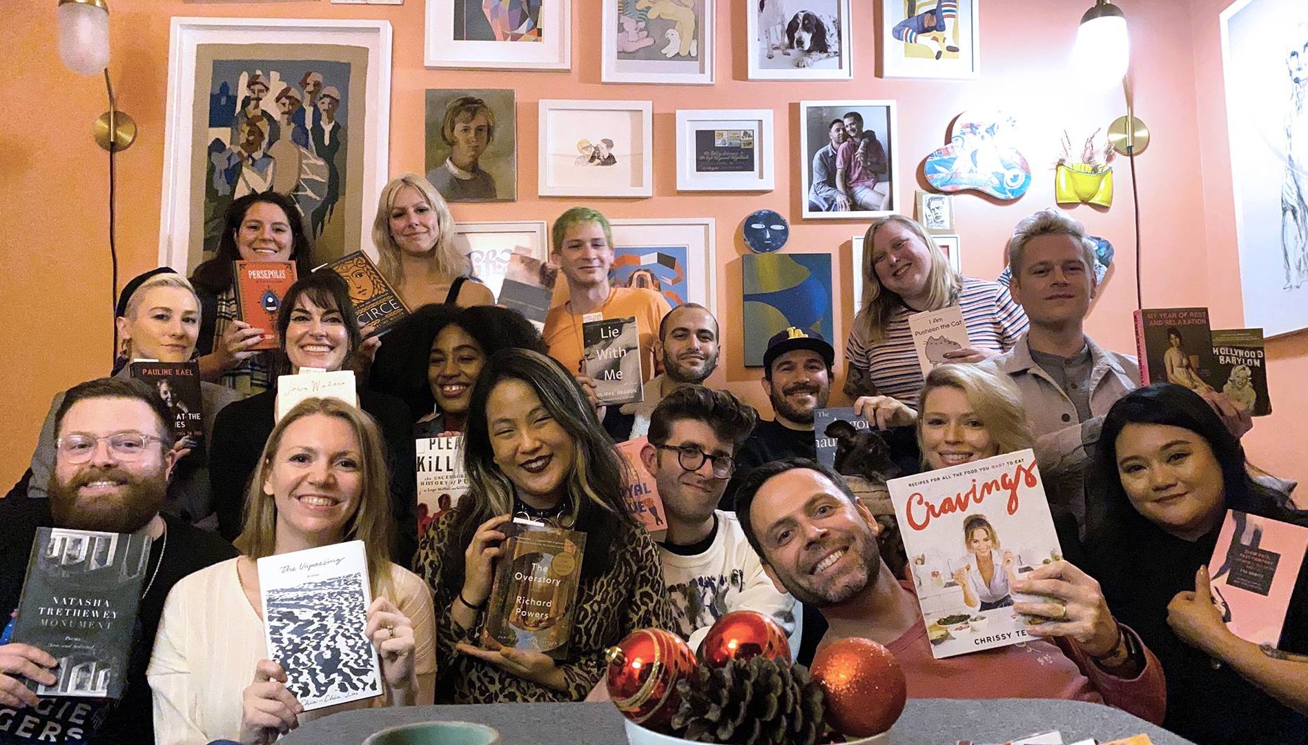 Photo of a group of people, holding books and smiling. Rewire PBS Living Book Club