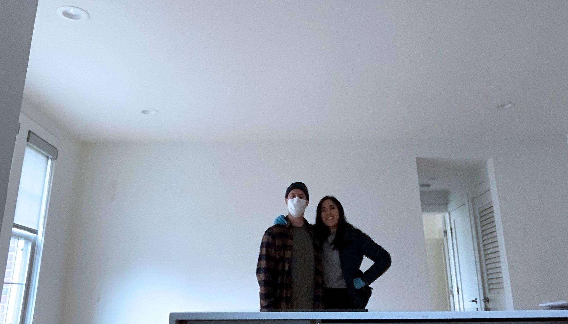 Photo of a couple standing in an empty apartment. Rewire PBS Living Moved