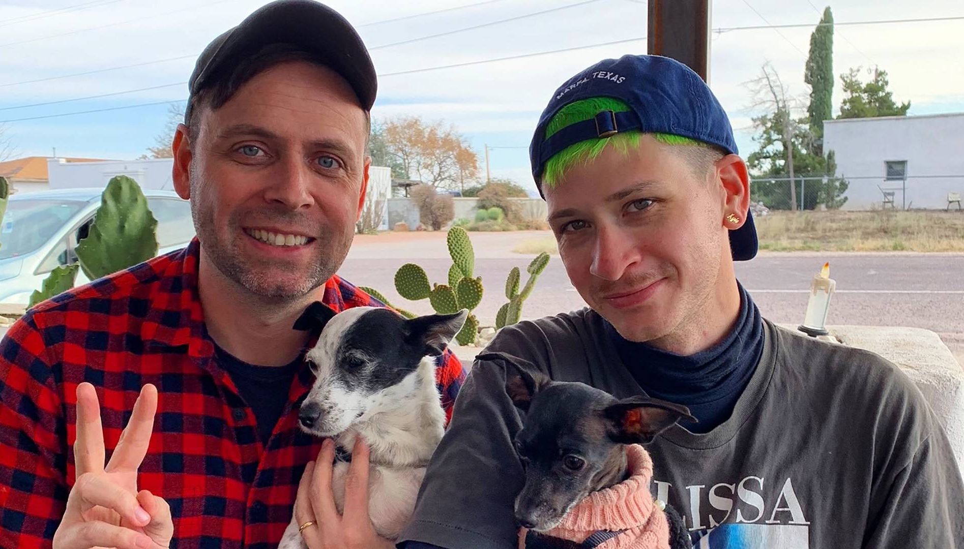 Photo of two men and two dogs. Rewire PBS Our Future Queer History