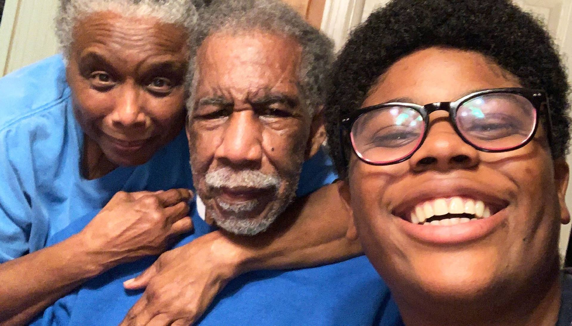 An intergenerational selfie of Lumiere Rostick and his grandparents. Rewire PBS Love Caregiver Lumiere Rostick