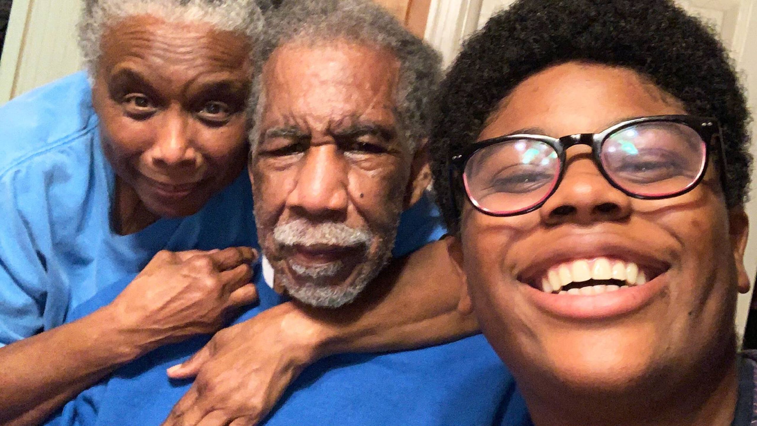 An intergenerational selfie of Lumiere Rostick and his grandparents. Rewire PBS Love Caregiver Lumiere Rostick