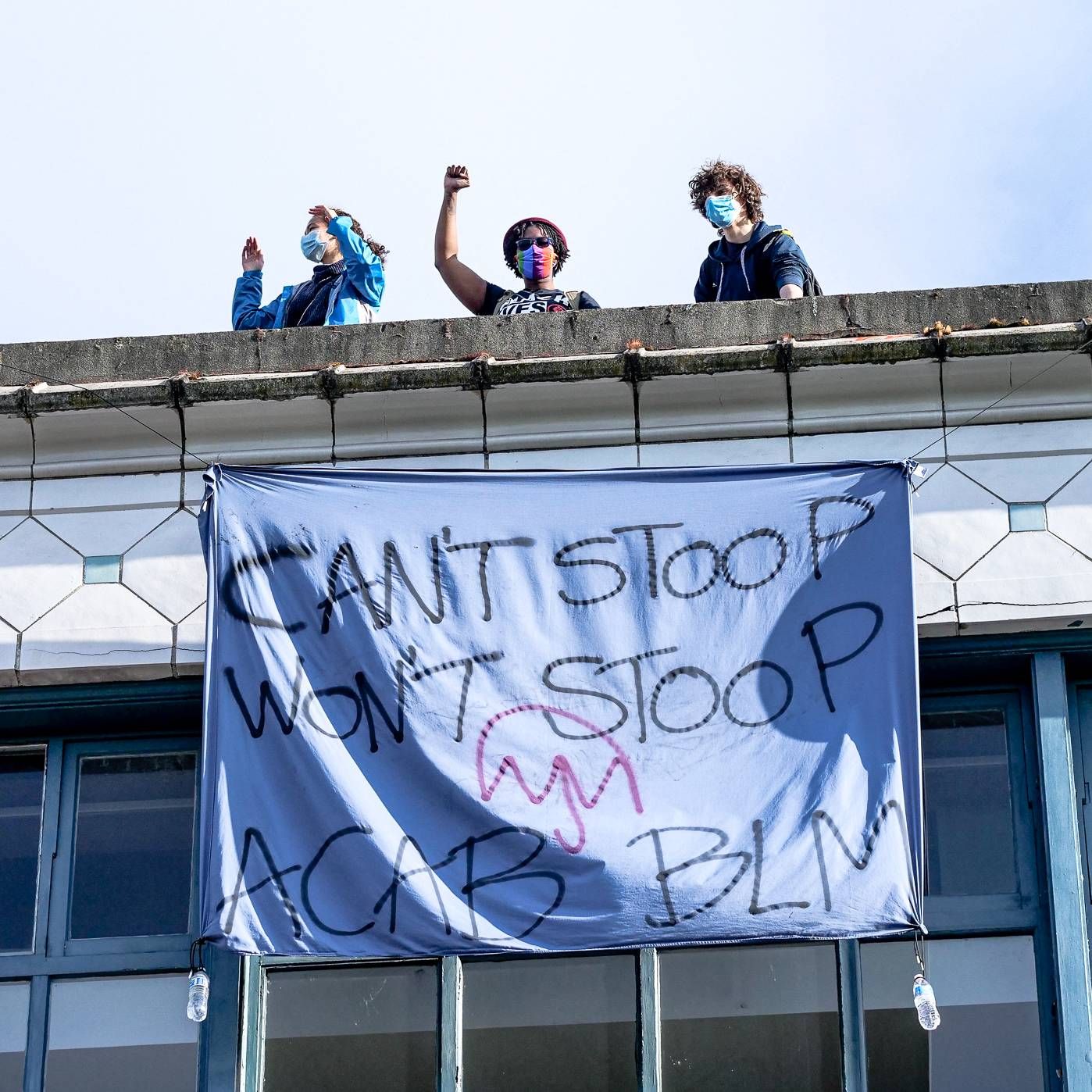 Protesters on a roof overlooking the Capitol Hill Occupied Protest in Seattle. Rewire PBS Our Future CHOP