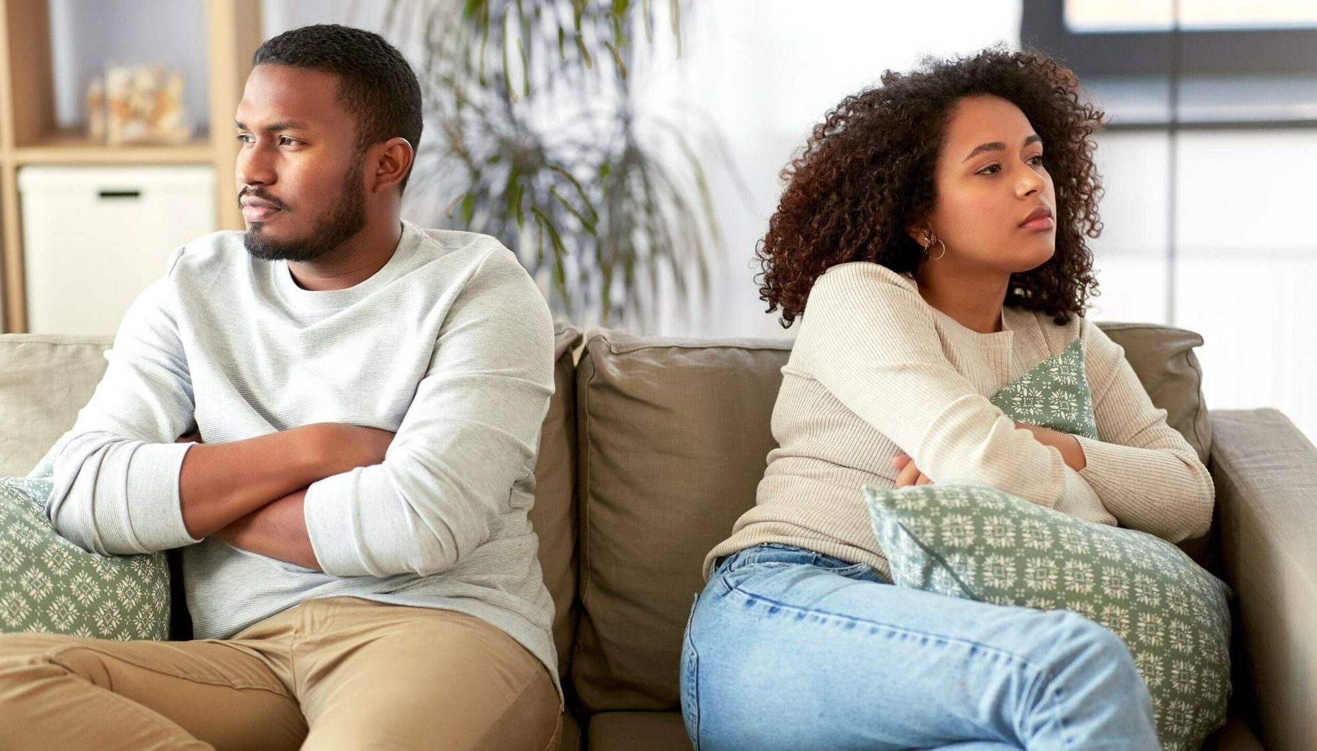 unhappy couple sitting on couch and having argument at home. Rewire PBS Love Couples Therapy
