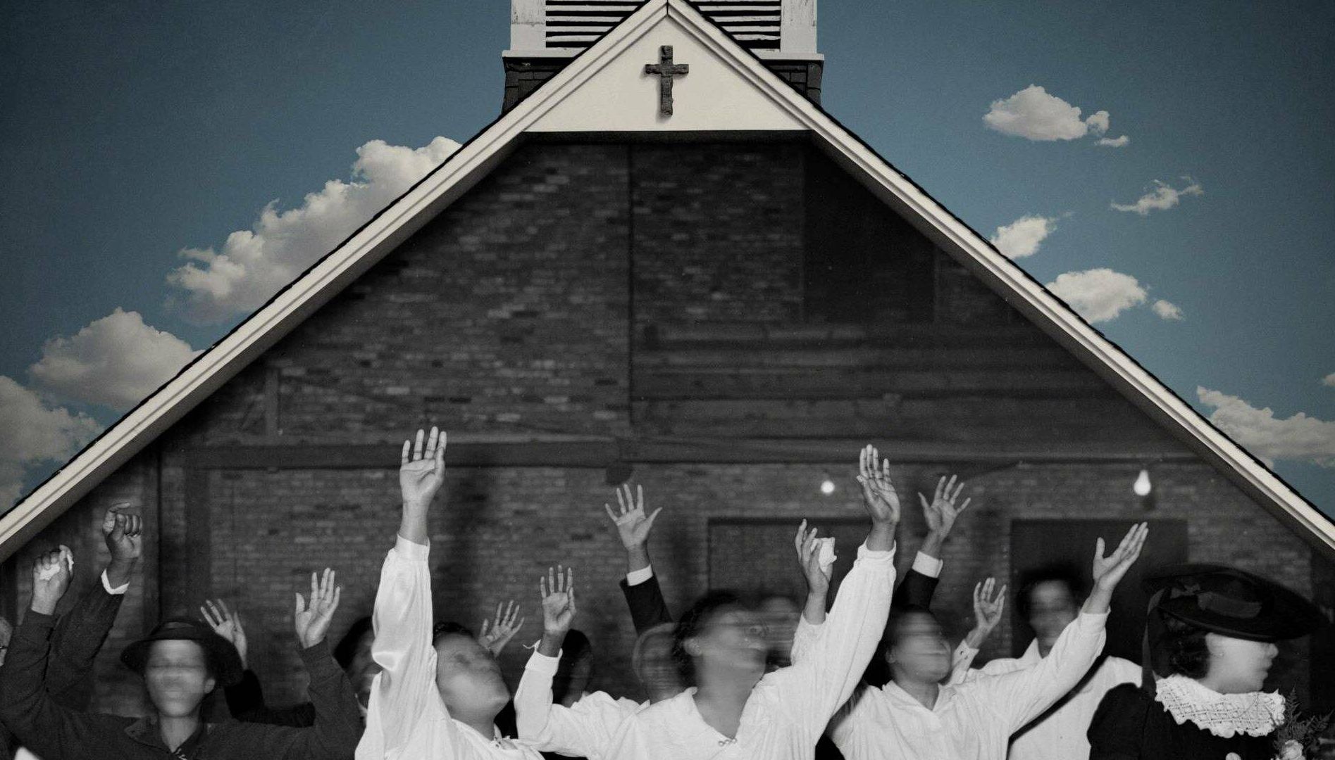Photo of people with hands in the air and faces blurred by motion, standing in front of a church