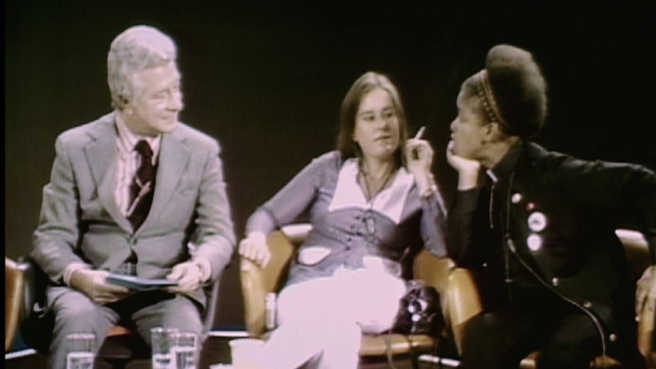 An old photograph of LGBTQ activists on a TV program. Rewire, PBS, cured
